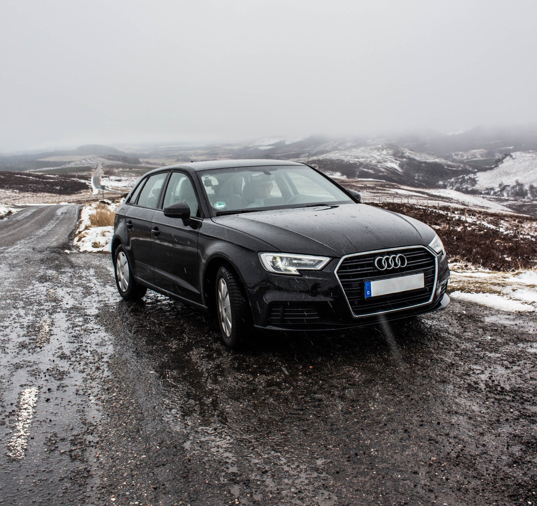 audi car parked on side of road