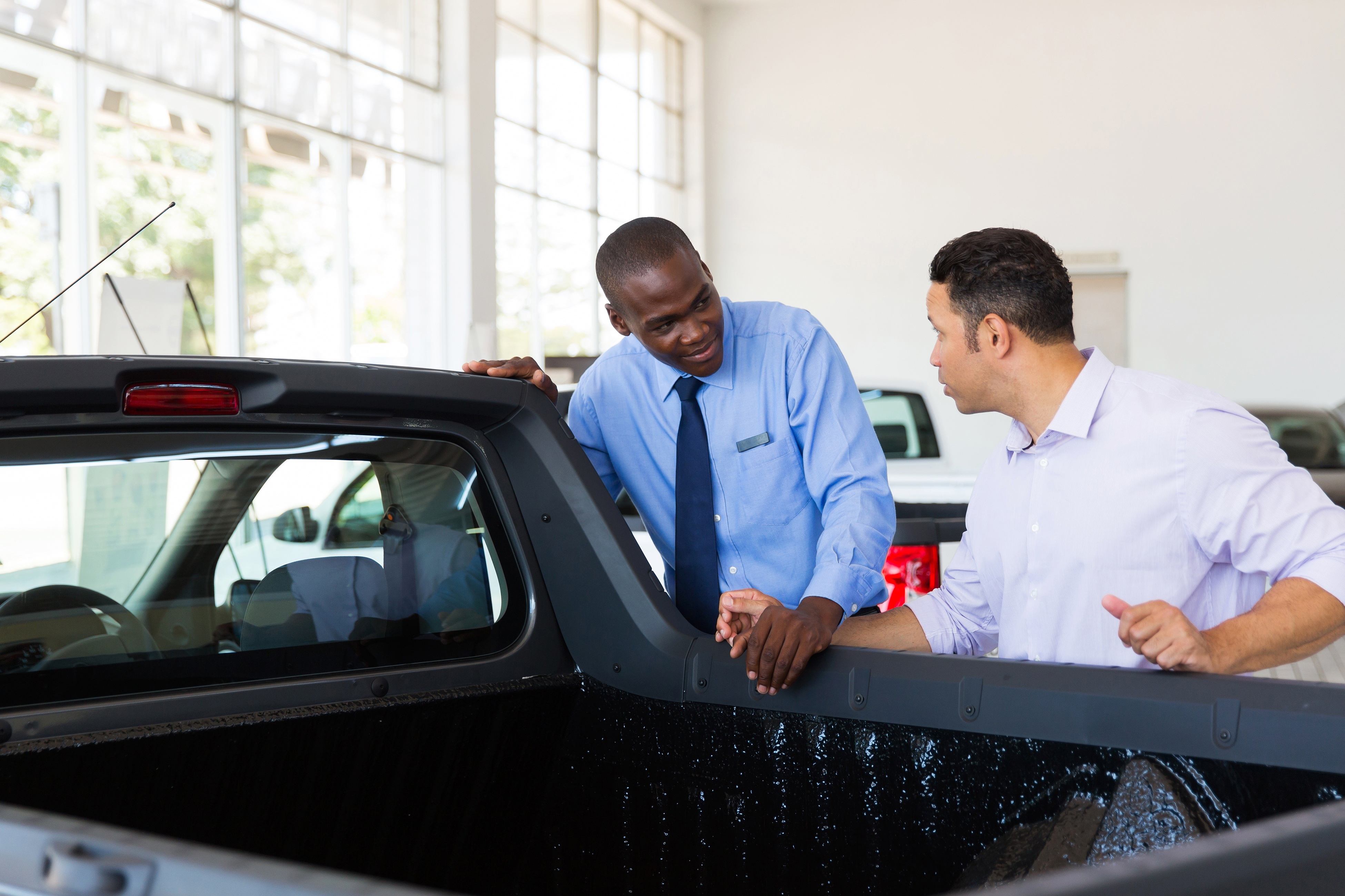 person buying a new truck at a dealership