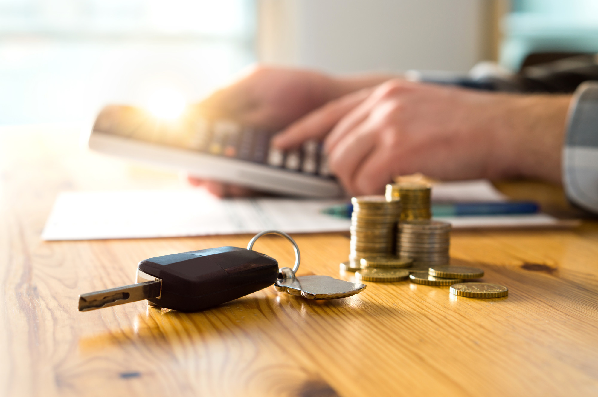 car keys and money on desk