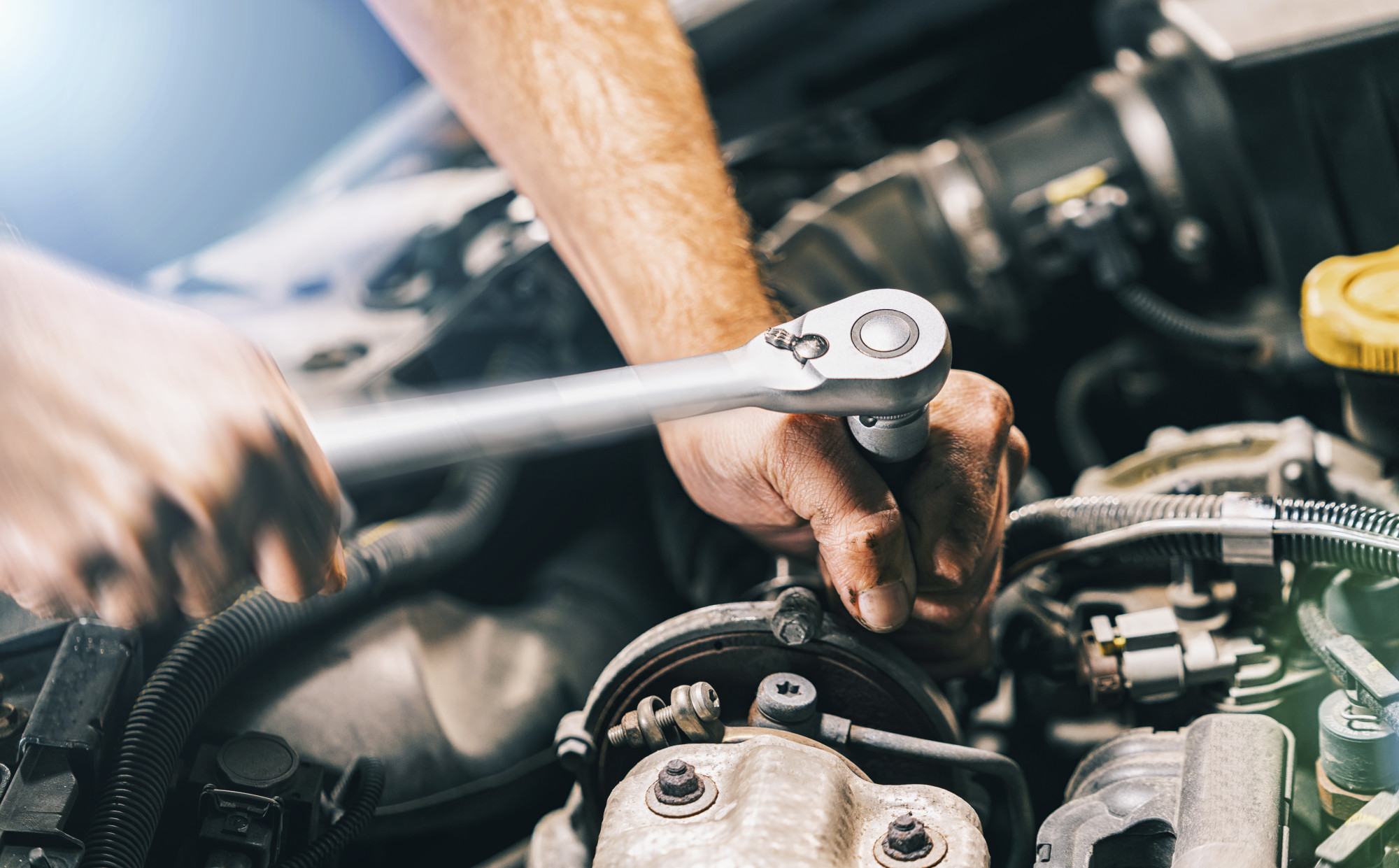 Man Repairing Car Engine