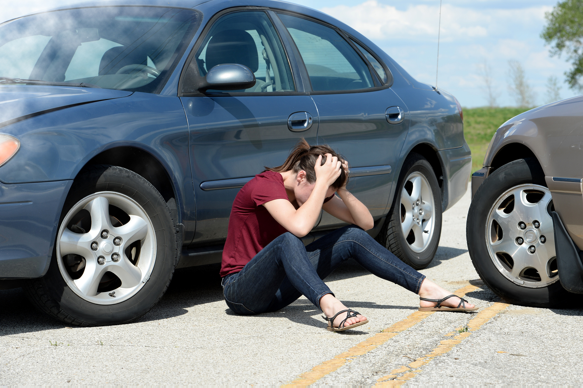 car accident and woman on ground